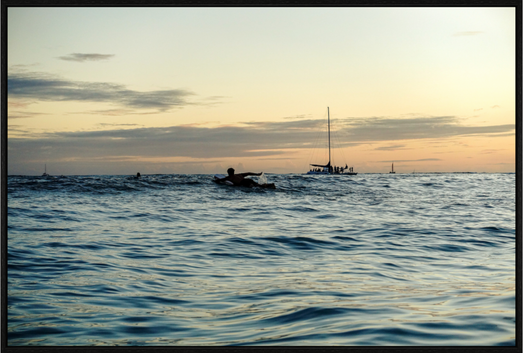 Main image Photograph of Surfer Paddling Out as Sun Sets in Waikiki