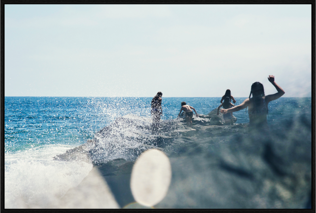 Main image Abstract Image of Girls Walking on Rock Jetty with Ocean Splashing